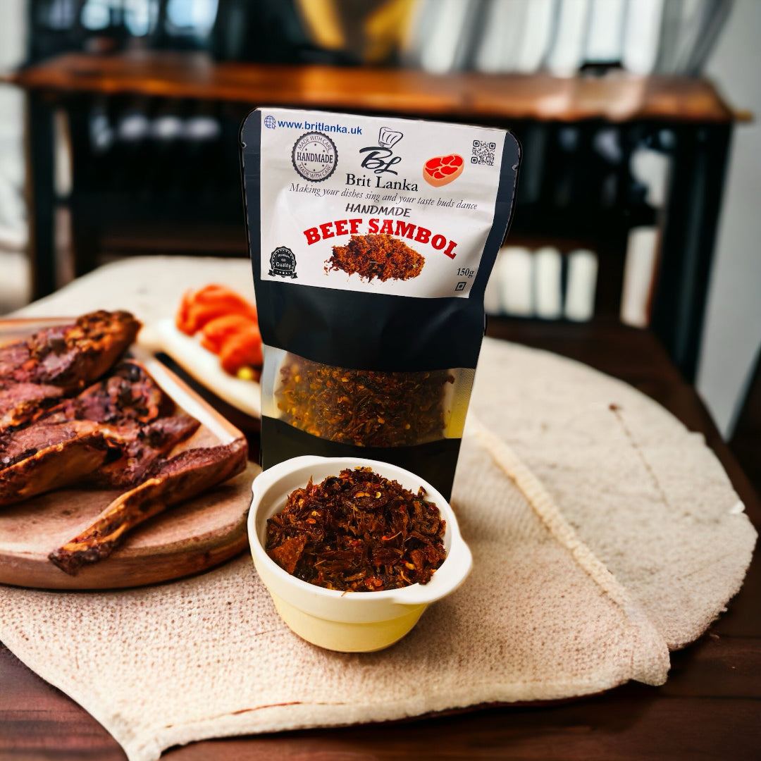 Packaged beef sambol product displayed alongside a bowl of beef sambol and slices of tomato on a wooden board.