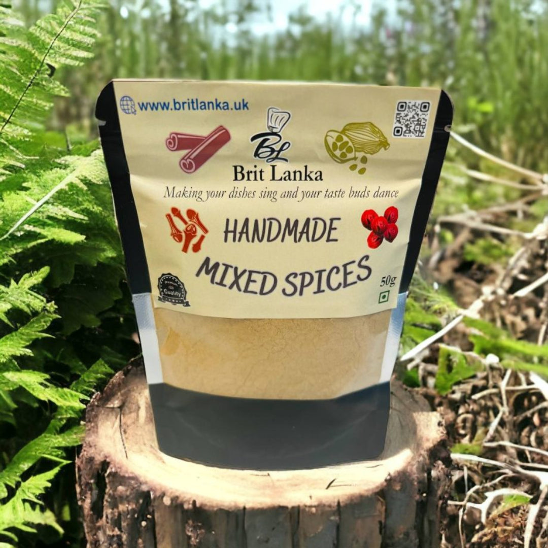 A package of 'Handmade Mixed Spices' by Brit Lanka placed on a wooden stump with a natural background.