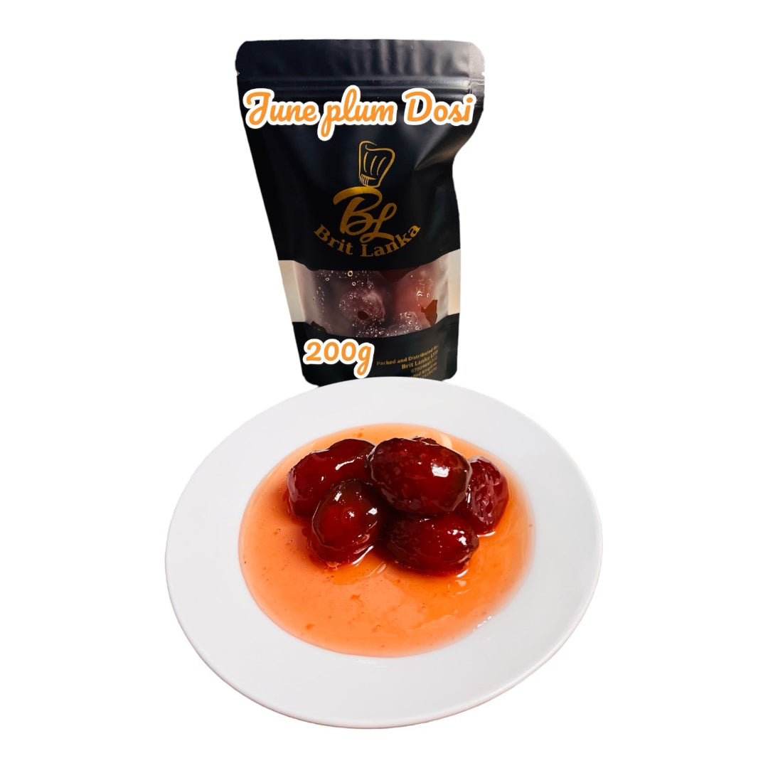 A jar of Handmade Ceylon June Plum Dosi (Ambarella) Sweet Pickle, 200g. The product is displayed with the contents served on a white plate, showing sliced June plums in a red sauce.