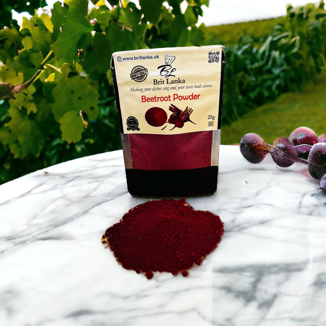 A small open packet of dehydrated Ceylon beetroot powder placed on a marble surface with fresh beetroot leaves in the background.